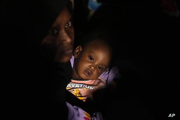 Sudanese evacuees wait before boarding a Saudi military ship to Jeddah port, at Port Sudan, Sudan, late Tuesday, May 2, 2023…