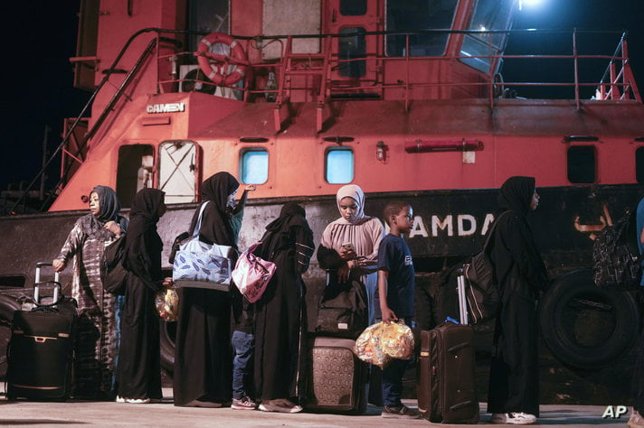 Sudanese evacuees wait before boarding a Saudi military ship to Jeddah port, at Port Sudan in Sudan, Wednesday, May 3, 2023…